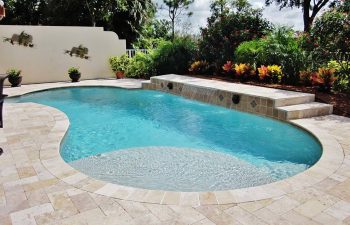 backyard swimming pool with waterfall