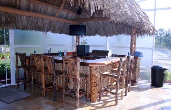 tiki hut with a pool bar and stools