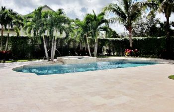 backyard swimming pool with jacuzzi and two fountains after renovation