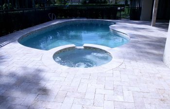 backyard pools and jacuzzi with light blue water color