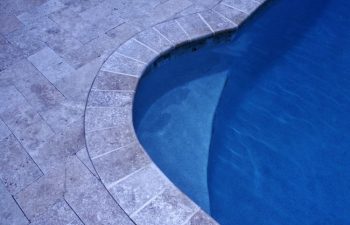 Interlocking brick paver pool deck