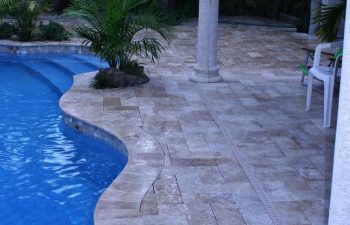 Interlocking brick paver pool deck