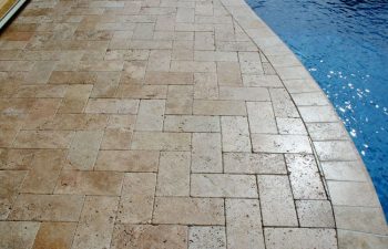 Interlocking brick paver pool deck