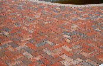 Interlocking brick paver pool deck