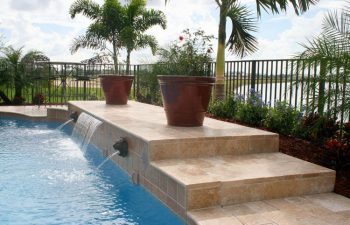 backyard swimming pool with water features