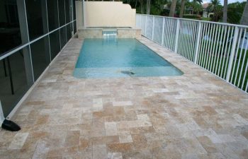 swimming pool with artistic pavers deck
