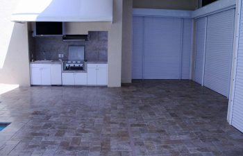 paver patio with an outdoor kitchen