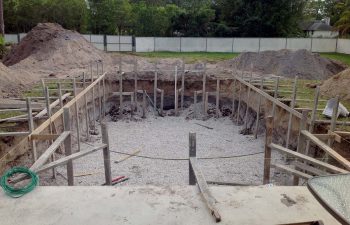 backyard swimming pool under construction