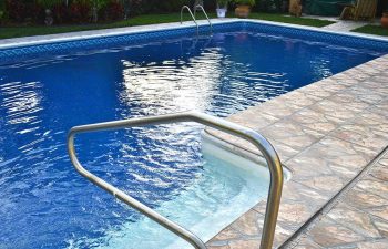 backyard in-ground swimming pool with vinyl liners