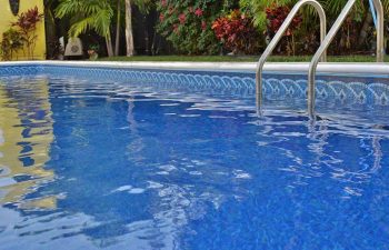 swimming pool with vinyl liners in a landscaped garden