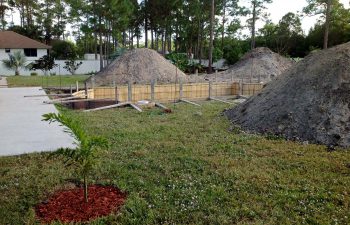 backyard swimming pool under construction