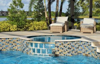 two sun longers on a backyard swimming pool patio