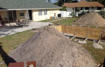 backyard swimming pool under construction