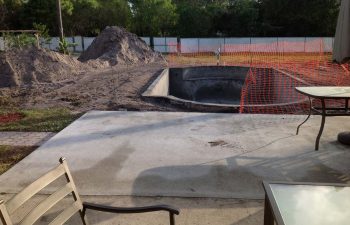 backyard swimming pool under construction