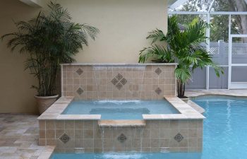 indoor spa pools with waterfalls and decorative tiles