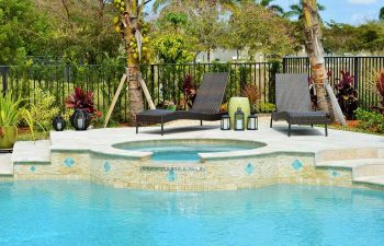 sunbeds on the patio of backyard spa pools