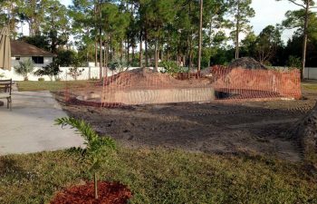 backyard swimming pool under construction