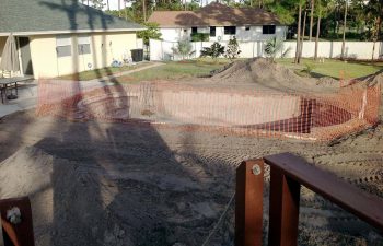 backyard swimming pool under construction