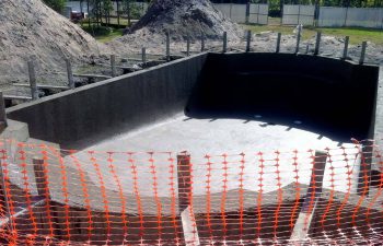 backyard swimming pool under construction