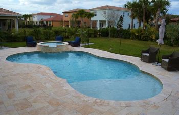 garden armchairs by a backyard swimming pool with jacuzzi