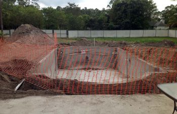 backyard swimming pool under construction