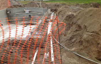 backyard swimming pool under construction