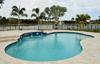 backyard swimming pool with a view of park and fountain