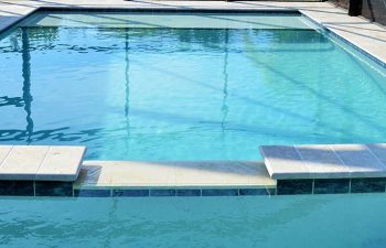 backyard indoor pools with light blue water color