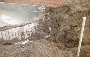 backyard swimming pool under construction