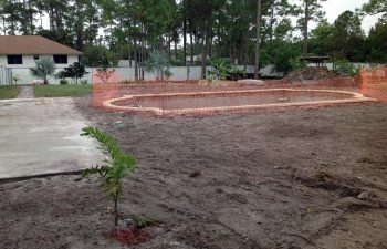 backyard swimming pool under construction
