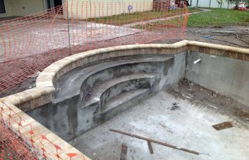 backyard swimming pool under construction