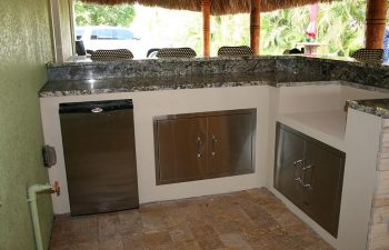 outdoor kitchen under tiki roof