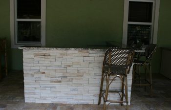 and outdoor bar with stools