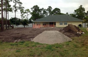 backyard with a swimming pool under construction