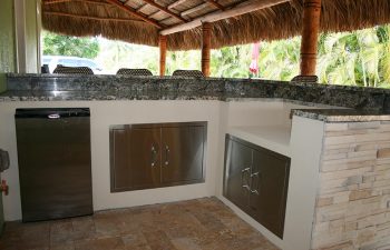 outdoor kitchen under tiki roof