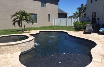 backyard swimming pool and jacuzzi with ebony blue water color
