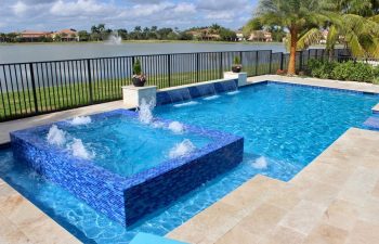 backyard swimming pool with and jacuzzi and built-in waterfall and fountains