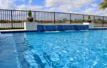 backyard swimming pool with built-in waterfall