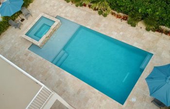 aerial view of backyard swimming pool with jacuzzi