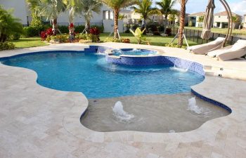 backyard swimming pool with built-in fountains and waterfalls