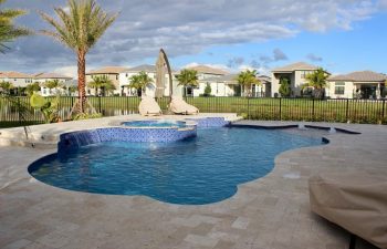 backyard swimming pool with built-in fountains and waterfalls