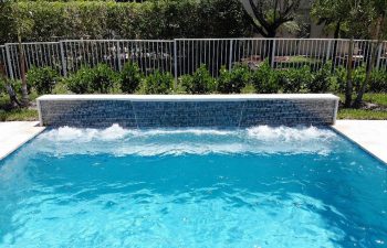 swimming pool with a waterfall