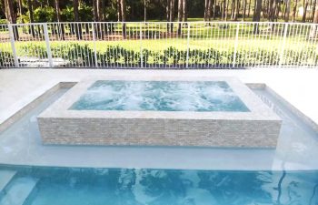 modern backyard swimming pool with jacuzzi