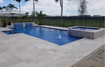 modern backyard swimming pool with jacuzzi and water features