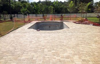 backyard swimming pool under construction