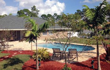 finished backyard swimming pool with paver deck