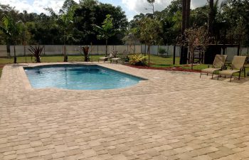 finished backyard swimming pool with paver deck