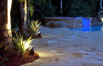 backyard swimming pool with jacuzzi and Travertine deck